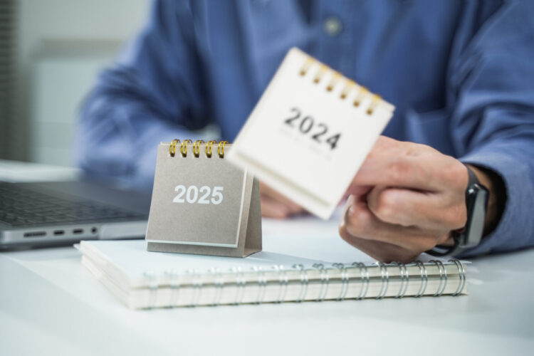 Businessman plans marketing and financial strategies for 2025 goals, plans business growth with AI technology and environmental care until the new year.